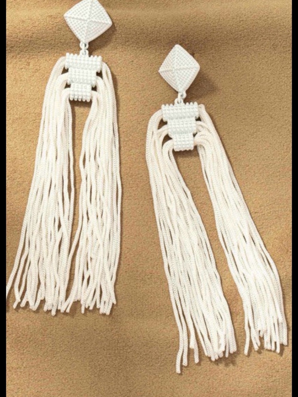 THREE LAYER TASSEL EARRINGS White tassel pierced earrings. Like new.